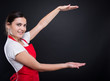 © Catalin Pop - Female employee smiling and holding something big