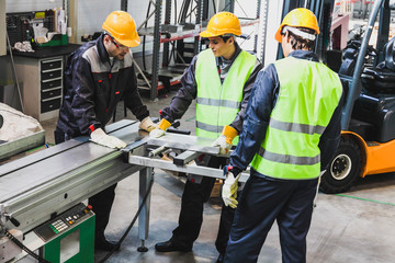 Wall Mural - Workers at CNC machine shop