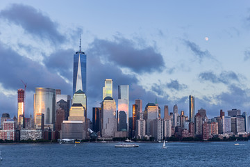Fototapete - Lower Manhattan Skyline and moon rising at blue hour, NYC, USA