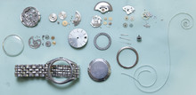Parts Of Deconstructed Watch Lying On Table