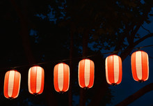 Paper Red-white Japanese Lanterns Chochin Shines On Dark Sky