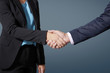 © sepy - Business people shaking hands at isolated background
