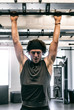 © seanlockephotography - Workspace: Man Doing Pullups In Office Fitness Center