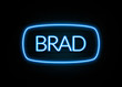 Brad  - colorful Neon Sign on brickwall