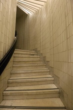 Narrow Stairway Covered By White Tiles