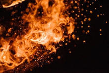 Close-up Of Embers From Fire Against Black Background