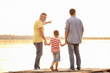 © Africa Studio - Little boy with dad and grandfather standing on pier