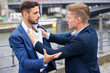 © wernerimages - two businessmen having a fight outside