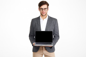 Portrait of a young smiling businessman in eyeglasses