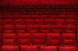 © pixelstories/Stocksy - Red theatre seats in rows