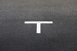 © Victor Deschamps/Stocksy - Letter T on Pavement