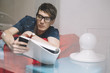 © pozzi/Stocksy - Young man on a red sofa