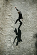 © Alita Ong/Stocksy - Businessman making funny shadow