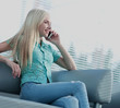 © ASDF - Photo of a girl talking on the phone and looking out the window