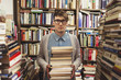 © pozzi/Stocksy - Young man in a book store