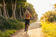 © BONNINSTUDIO/Stocksy - Back view of a hipster couple having fun on a bicycle in the forest.