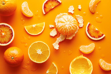 Citrus Fruits On Orange Background