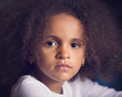 © absphotoco/Stocksy - Closeup portrait of thoughtful young girl with frizzy hair