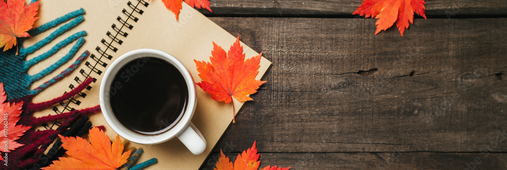 Autumn leaves and a cup of coffee with plaid on old vintage wooden background. - obrazy, fototapety, plakaty 