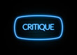 Critique  - colorful Neon Sign on brickwall