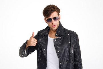 Wall Mural - Portrait of a handsome young man in a leather jacket