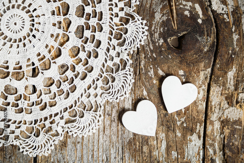 Fotovorhang - Vintage Lace fabric and white wooden hearts on the old wood texture.Top view with copy space. Shabby chic background for wedding, valentines day or mother day. (von stillforstyle)