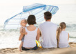 © JackF - Parents with kids sitting with back forward