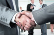 © ASDF - Closeup of a business handshake