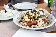 Dakos Salad And Tzatziki Yogurt Sauce, Greek Meal Tipycal. Taken In Naxos

