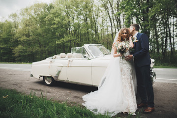 Happy bride and groom posing after wedding ceremony