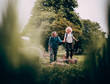 © Criene Images - Mature Couple hiking trough beautiful green fields
