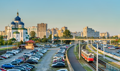 Canvas Print - Cathedral of the Holy Trinity and a light rail tram in Troieshchyna - Kiev, Ukraine