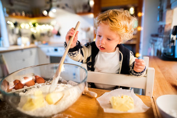 Canvas Print - Young family making cookies at home.