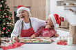© Yakobchuk Olena - Joyful granny celebrating winter holidays with her grandchild