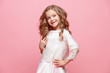 © master1305 - The beautiful little girl in dress standing and posing over white background