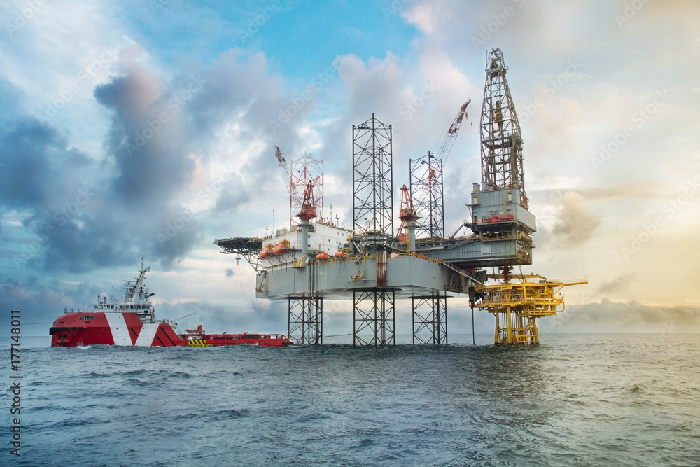 Oil and gas drilling rig work over remote wellhead platform to ...