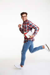 Poster - Full length portrait of a smiling young male student