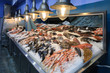 Variety of sea fishes on the counter in a greek fish shop.