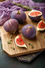 Sticker - Juicy fig fruits on a dark background