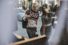 Three Young Women During Shopping In The City