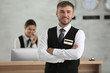 Male hotel receptionist at workplace