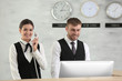 © Africa Studio - Two hotel receptionists at work