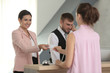 © Africa Studio - Young woman and two receptionists in hotel