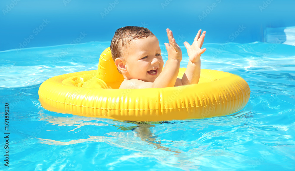 Child swimming lesson. Cute little boy with inflatable ring in pool ...