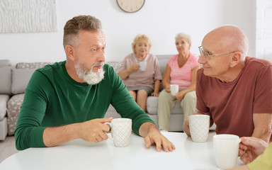 Wall Mural - Group of elderly people resting at home