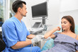 © Africa Studio - Doctor conducting ultrasound examination of patient's elbow in clinic
