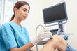 © Africa Studio - Doctor conducting ultrasound examination of patient's knee in clinic