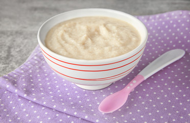 Sticker - Ceramic bowl with porridge for baby on fabric