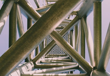 Complex Ladder. Urban Geometry, Street Photography, Complex Design. Modern Art. Abstract Art Design.Steel Beams. Industrial Art. Industrial Design. Blue Sky Background. Industrial Geometry. Steel Art,