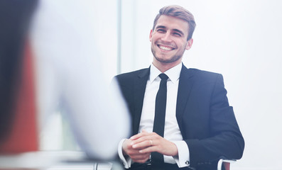 Poster - Image of young businessman communicating with his colleague